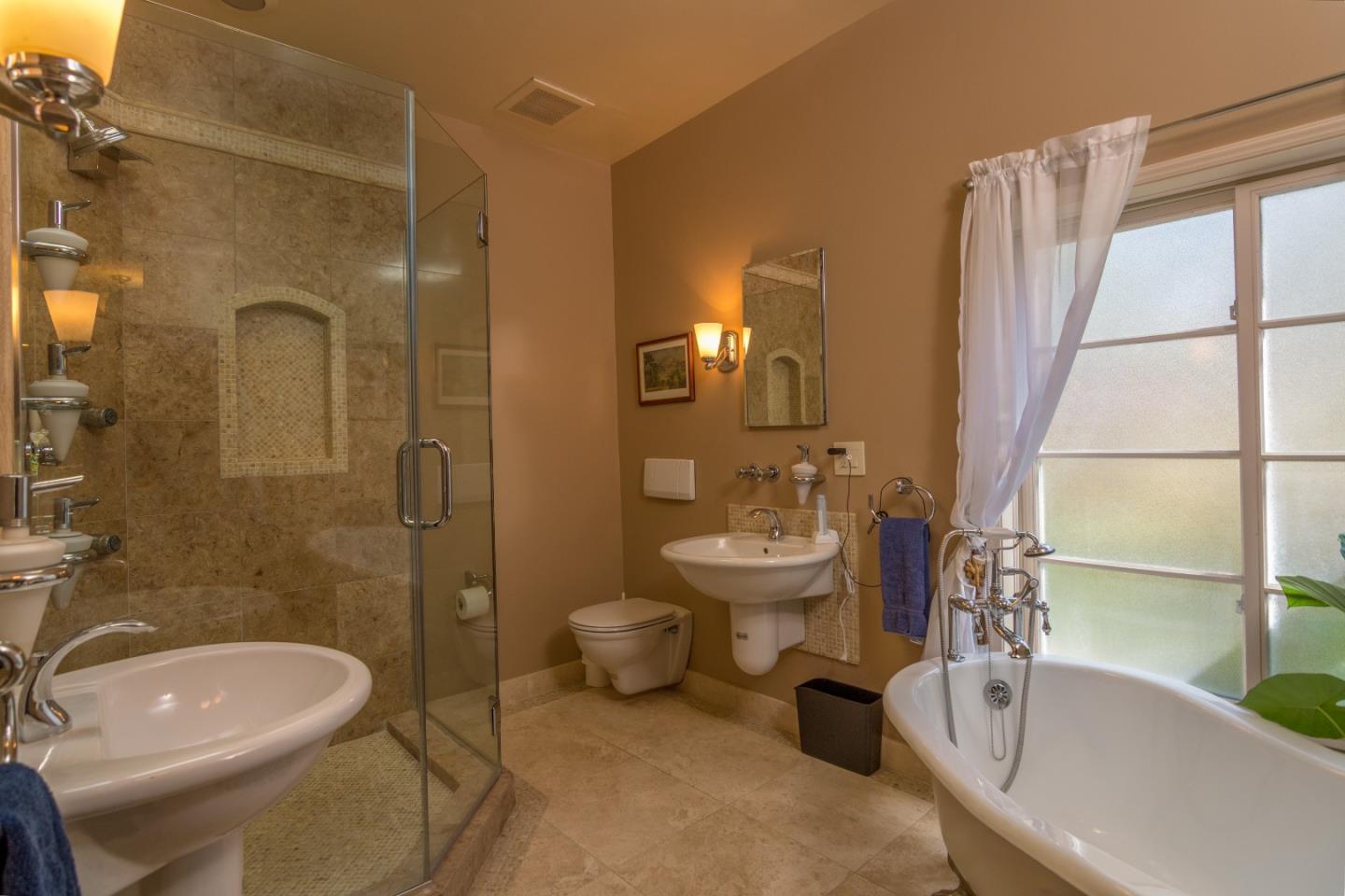 14795 Bohlman Road Saratoga, CA 95070 - Photo 32 of 50 a bathroom with a sink toilet a shower and bathtub