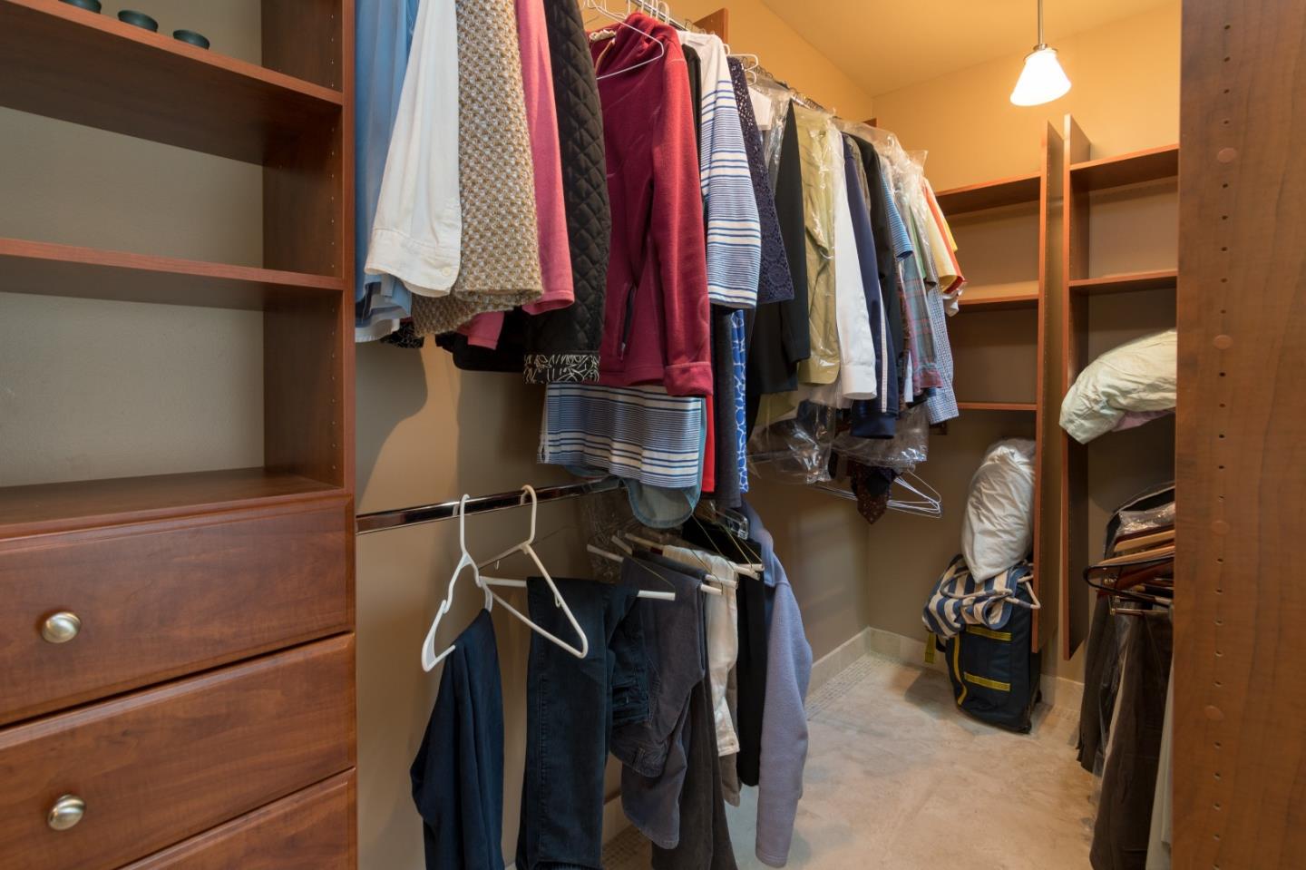 14795 Bohlman Road Saratoga, CA 95070 - Photo 34 of 50 a view of walk in closet with clothes and shoes