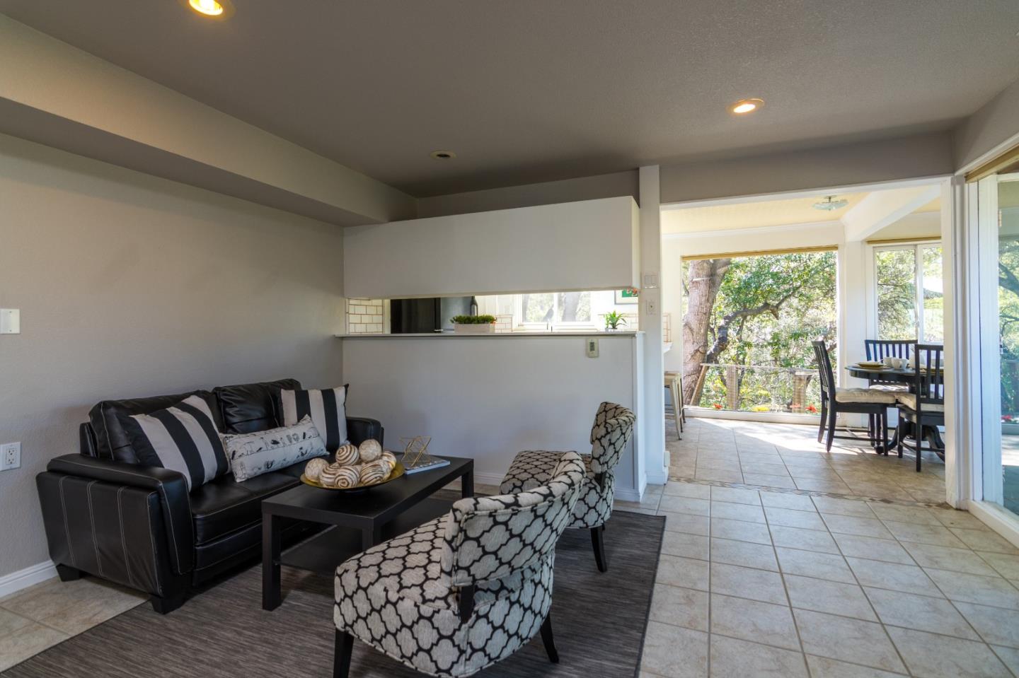 14795 Bohlman Road Saratoga, CA 95070 - Photo 38 of 50 a living room with furniture and large windows
