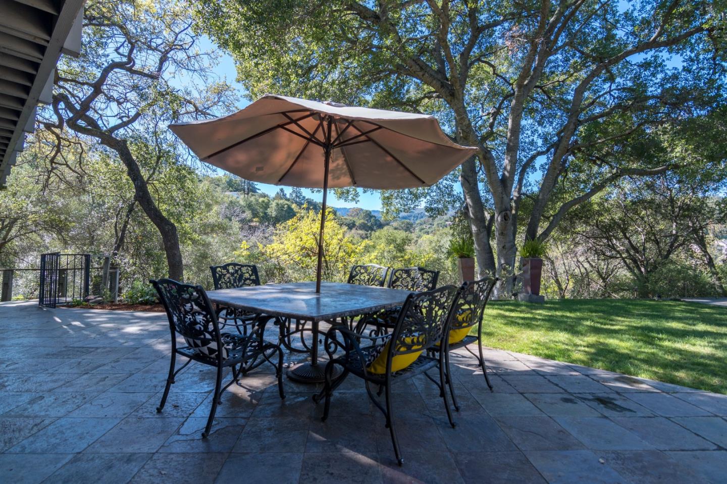 14795 Bohlman Road Saratoga, CA 95070 - Photo 42 of 50 a view of an outdoor space with furniture and umbrella