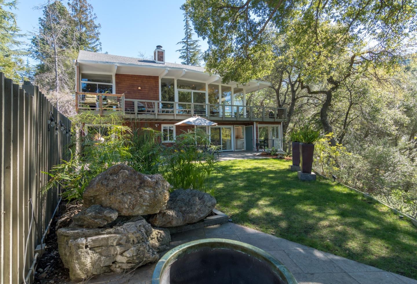 14795 Bohlman Road Saratoga, CA 95070 - Photo 49 of 50 a front view of a house with garden