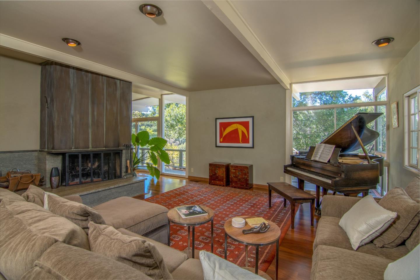 14795 Bohlman Road Saratoga, CA 95070 - Photo 9 of 50 a living room with furniture a rug and a large window