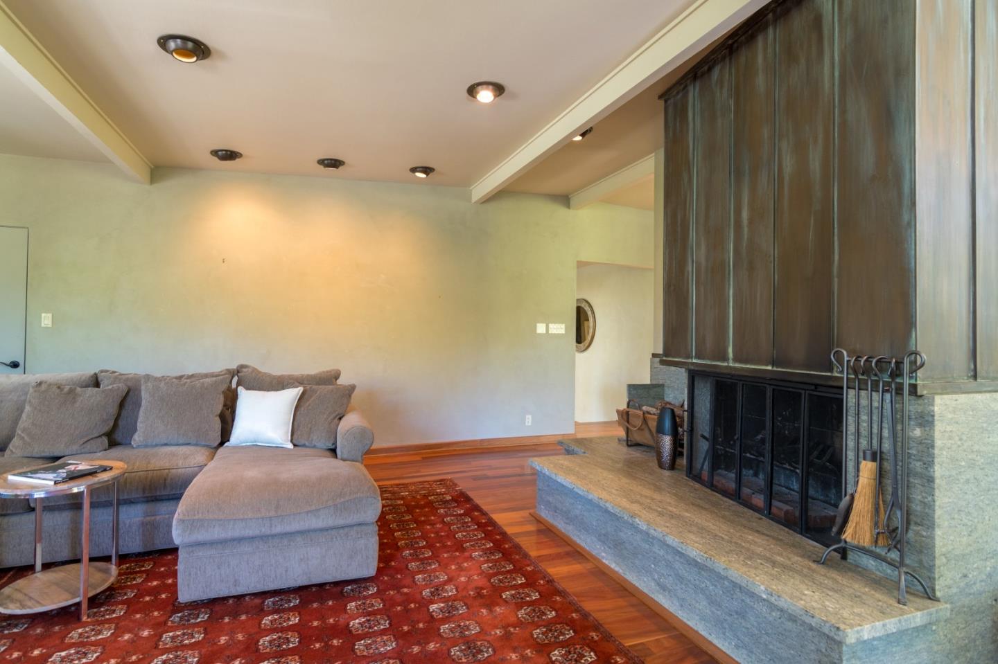 14795 Bohlman Road Saratoga, CA 95070 - Photo 10 of 50 a bedroom with furniture and a rug