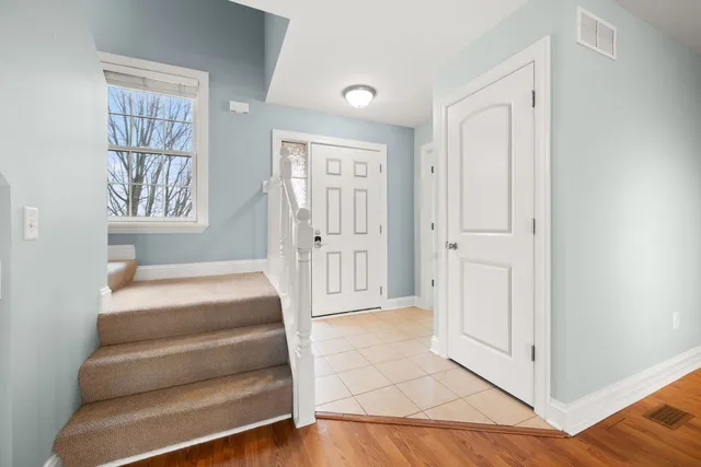 a view of an entryway with front door