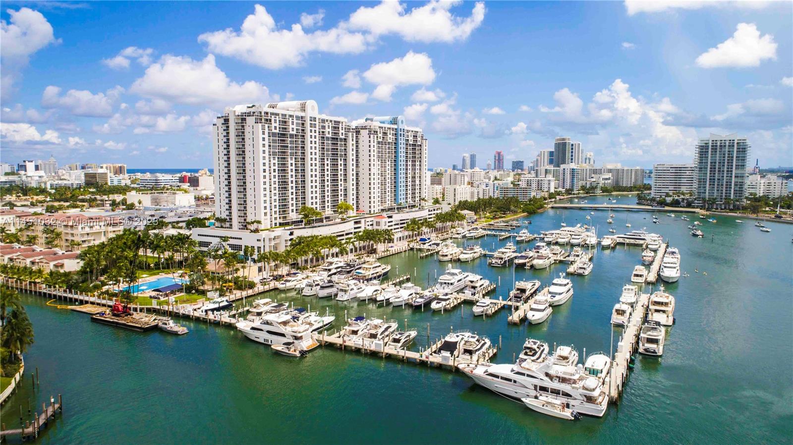 1800 Sunset Harbour Drive, Unit 1001 Miami Beach, FL 33139 - Photo 1 of 1 a view of a city with lawn chairs