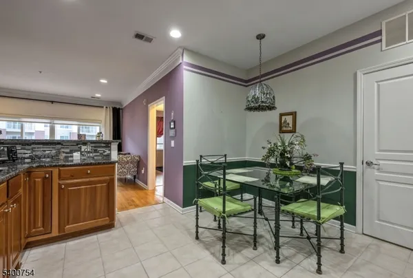 a kitchen with stainless steel appliances granite countertop sink and cabinets
