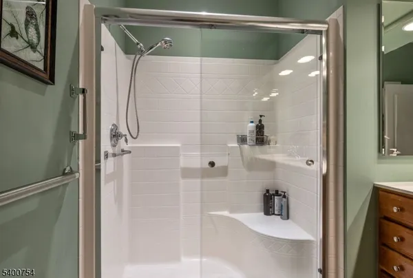 a bathroom with a shower and a sink