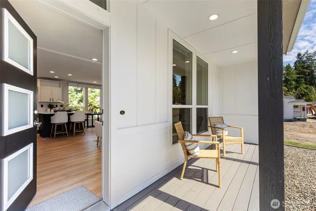 a work room with furniture and wooden floor