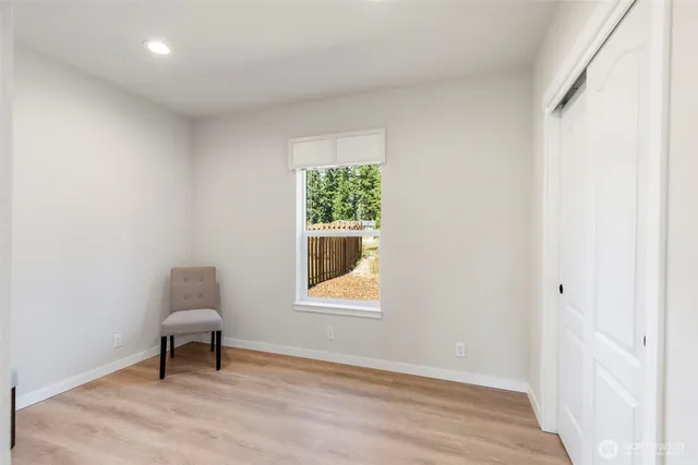 a room that has a window and a chair