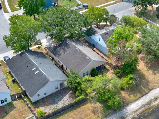 an aerial view of house with yard swimming pool and outdoor seating
