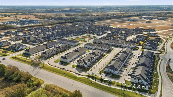 an aerial view of residential building and ocean view
