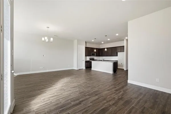 a view of kitchen with wooden floor