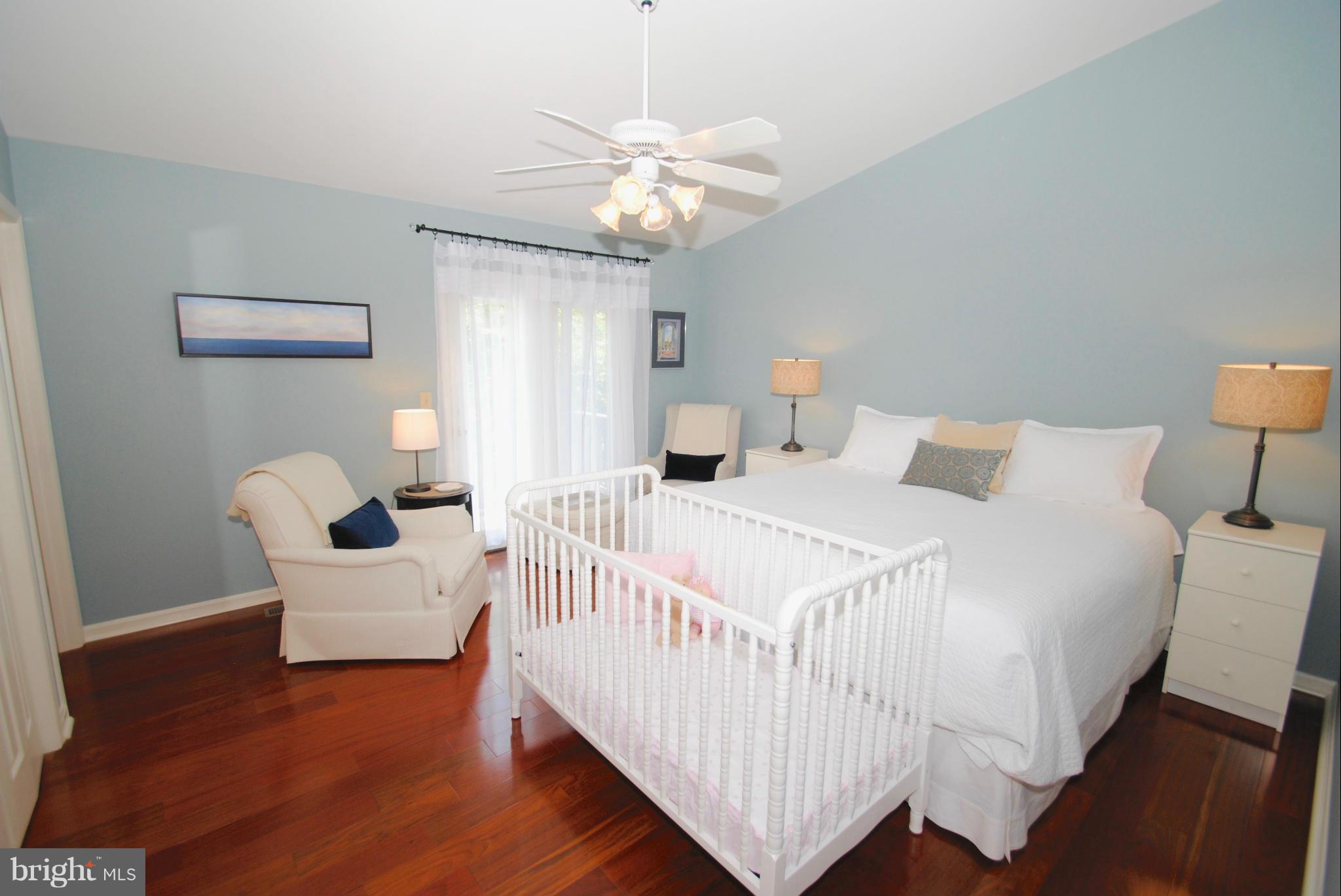 1531 Mayfield Road Edgewater, MD 21037 - Photo 14 of 26 a bedroom with a bed and a chandelier