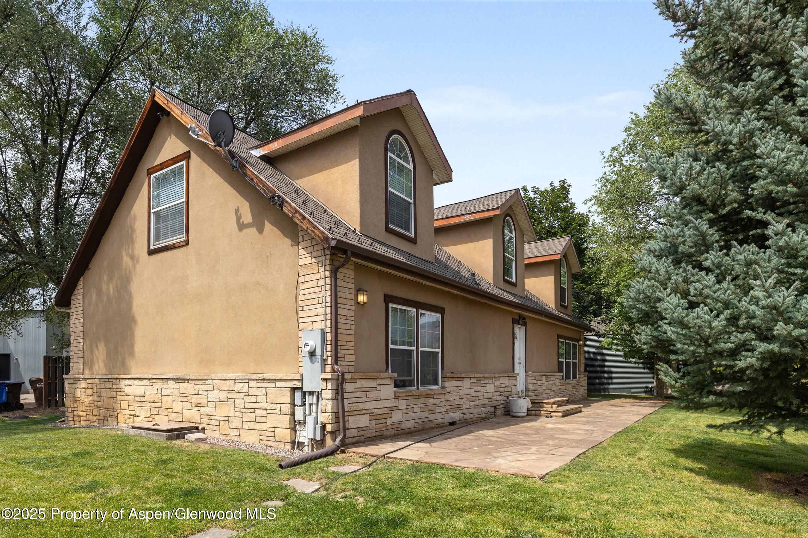 296-298 North 7th Street Carbondale, CO 81623 - Photo 6 of 11 a front view of a house with a yard