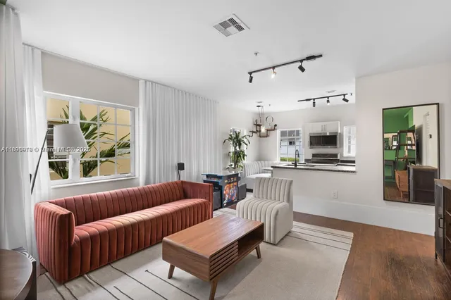 a living room with furniture and a window