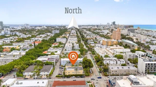 an aerial view of residential building and parking space