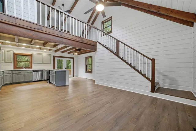 a view of an entryway with wooden floor