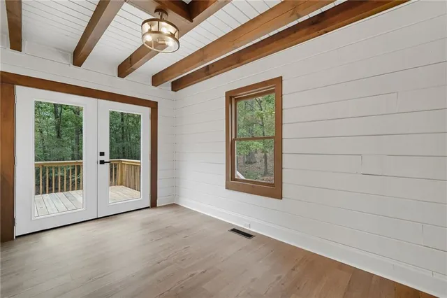 a view of an empty room with a window