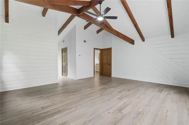 a view of an entryway with wooden floor