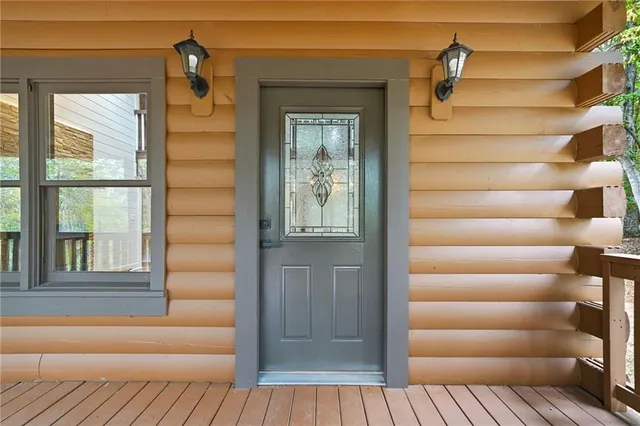 a view of front door with wooden door