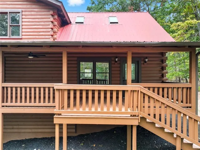 a view of a two chairs and table in the balcony