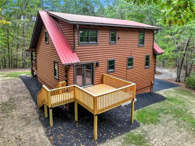 a small wooden bench sitting in front of a house