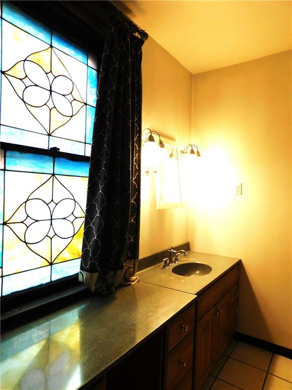 423 Alice Street Pittsburgh, PA 15210 - Photo 11 of 17 a bathroom with a sink and a window
