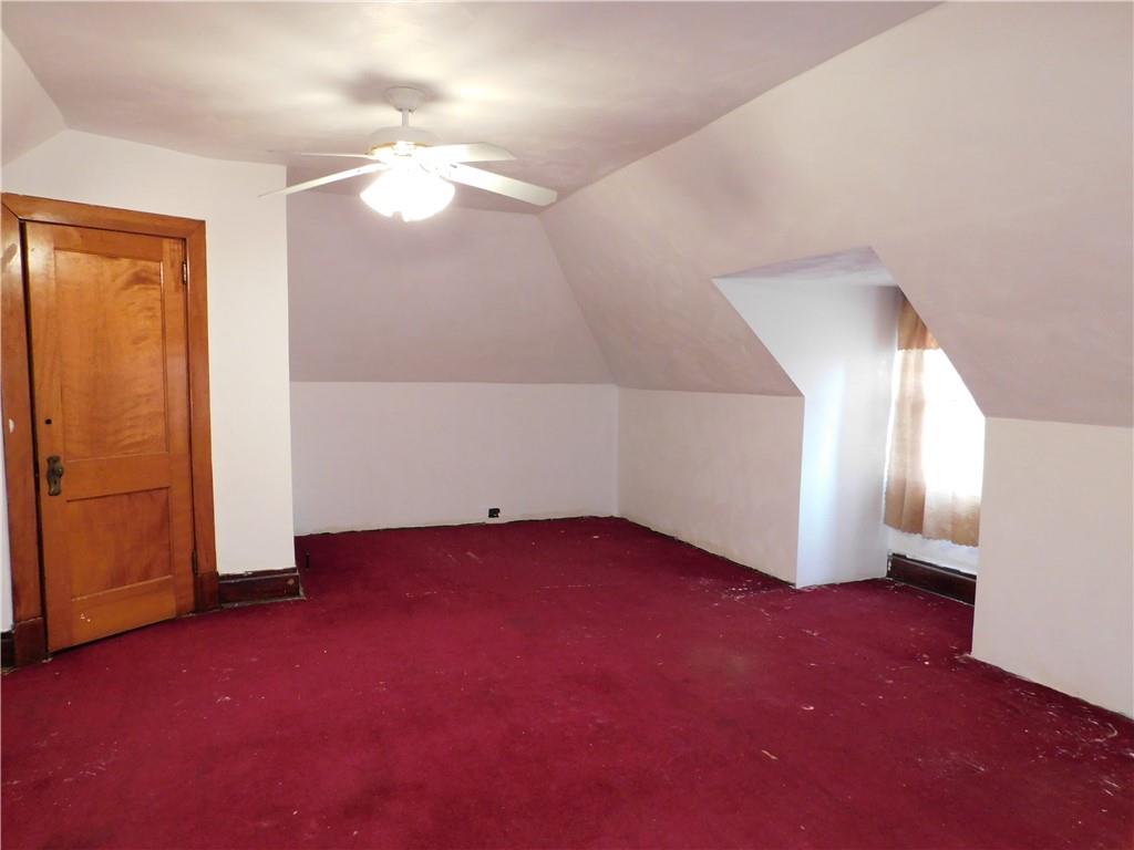 423 Alice Street Pittsburgh, PA 15210 - Photo 16 of 17 an empty room with windows and entrance