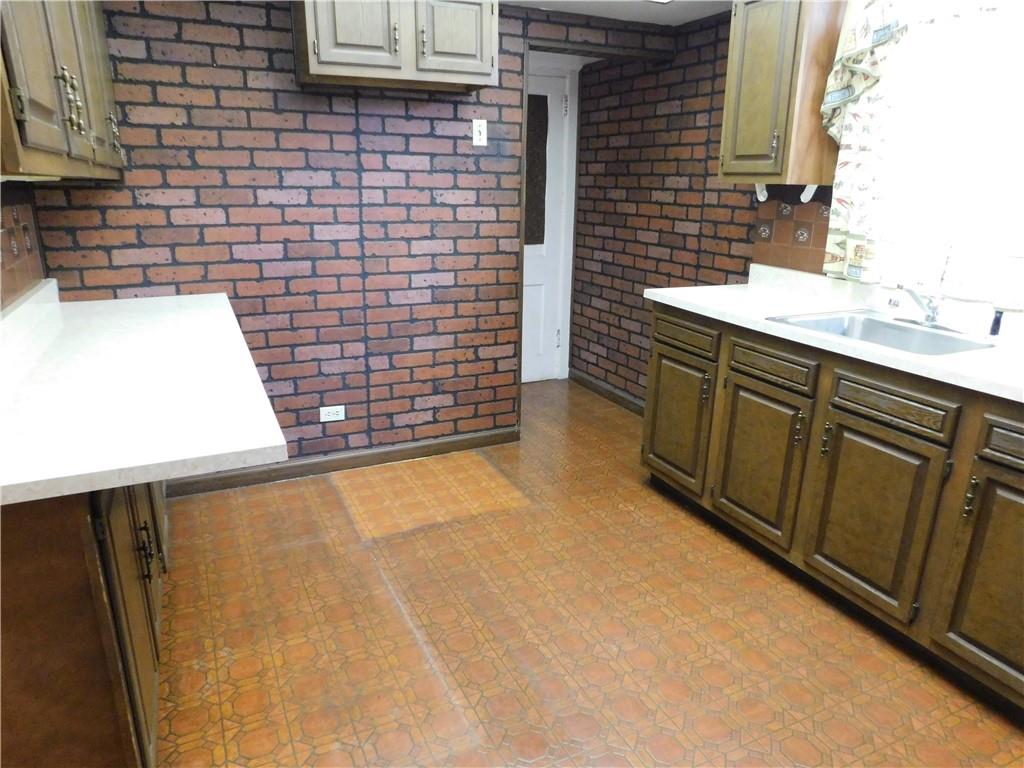 423 Alice Street Pittsburgh, PA 15210 - Photo 9 of 17 a bathroom with a sink and a mirror