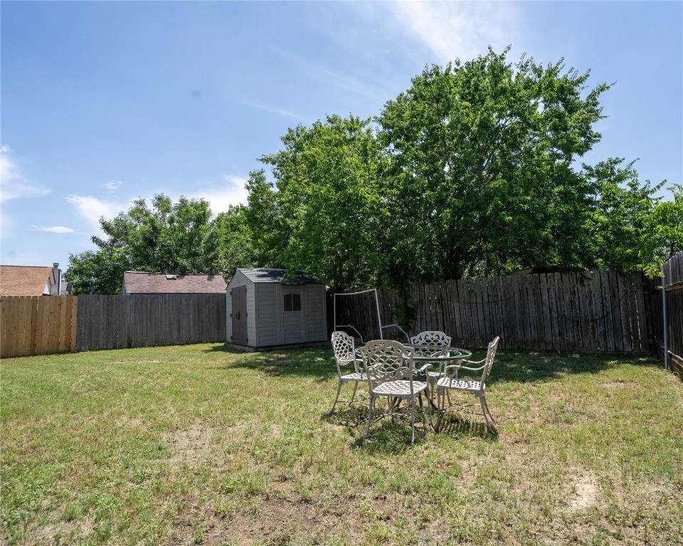 611 Penny Lane Cedar Park, TX 78613 - Photo 20 of 28 a view of a chair and table in the backyard