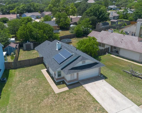 an aerial view of a house having yard