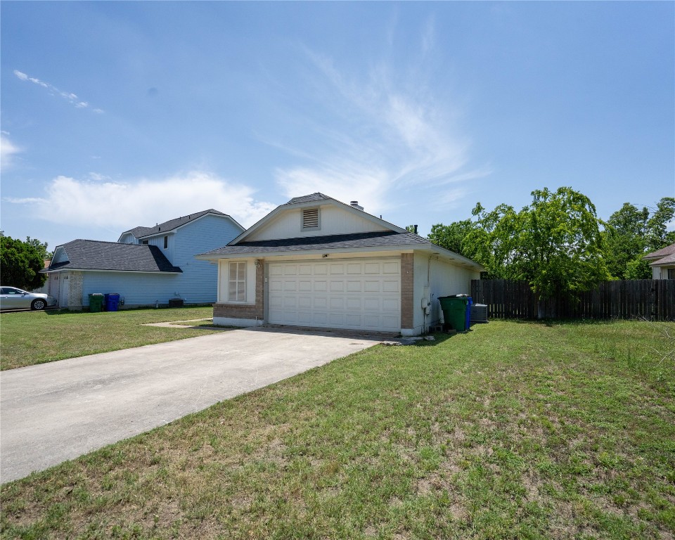 611 Penny Lane Cedar Park, TX 78613 - Photo 3 of 28 a front view of a house with a yard and garage