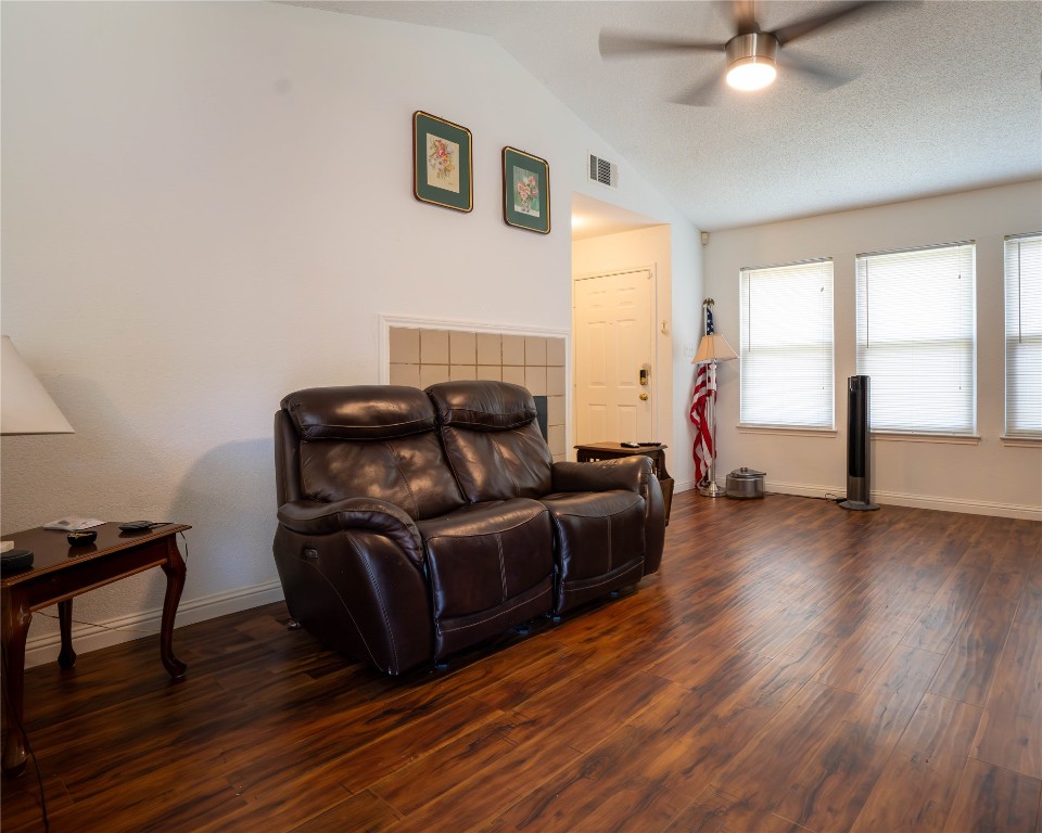 611 Penny Lane Cedar Park, TX 78613 - Photo 4 of 28 a living room with furniture and a wooden floor