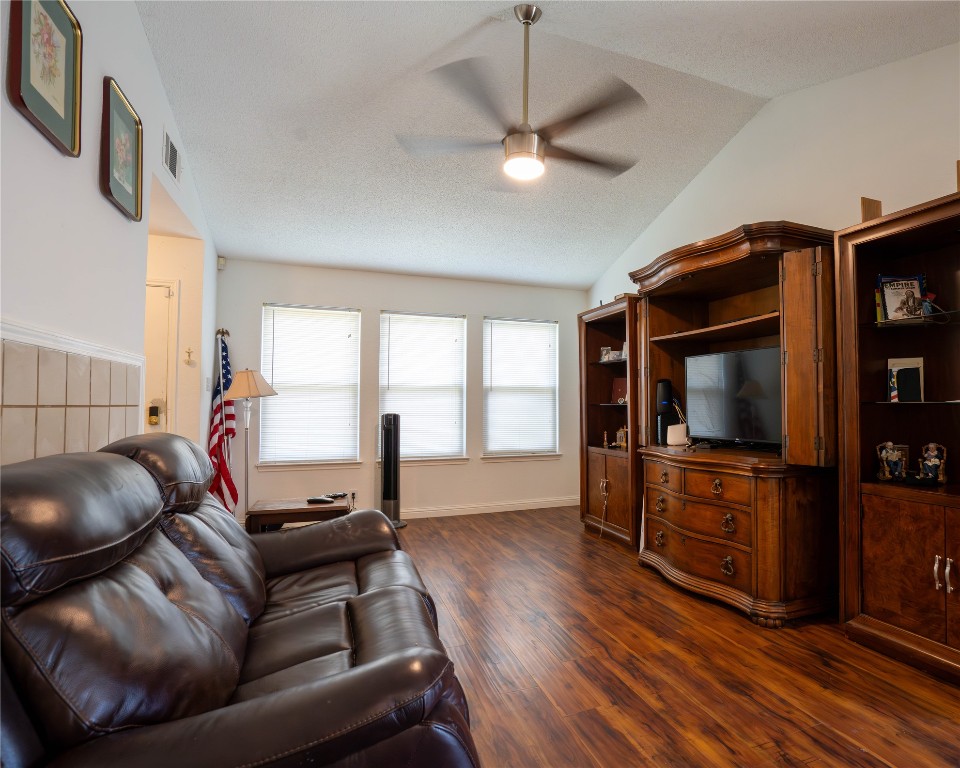 611 Penny Lane Cedar Park, TX 78613 - Photo 6 of 28 a living room with furniture and a flat screen tv