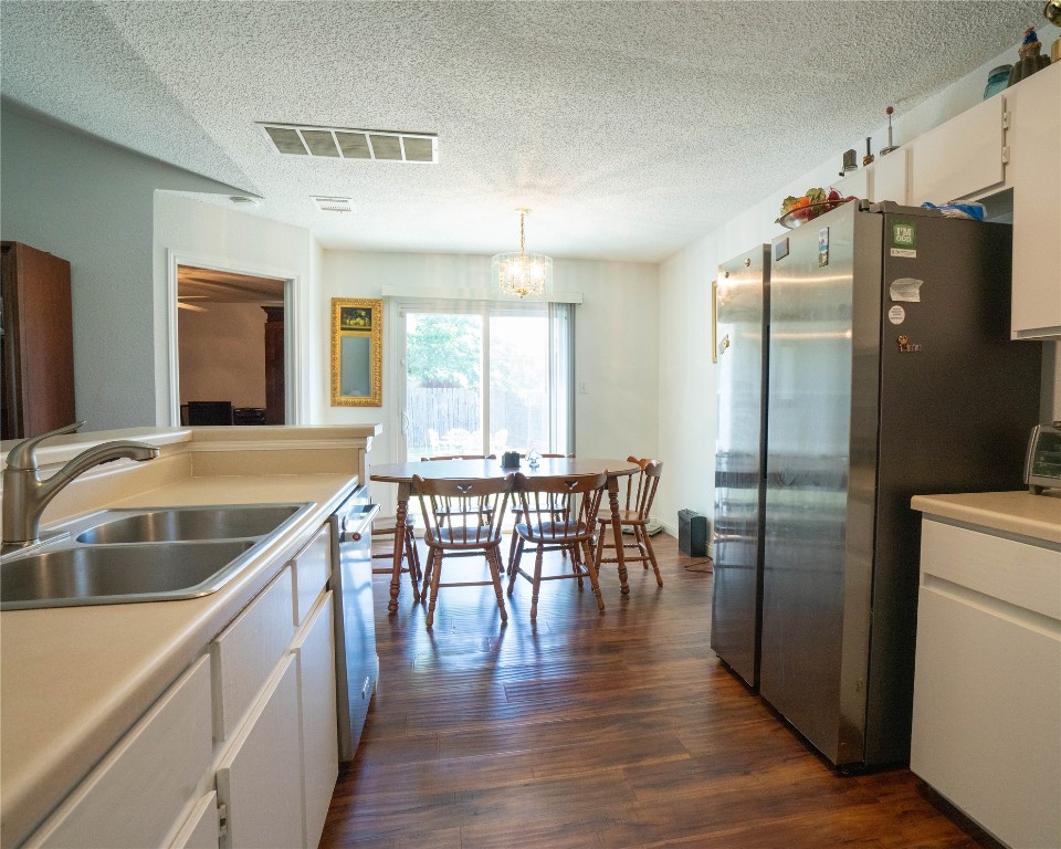 611 Penny Lane Cedar Park, TX 78613 - Photo 9 of 28 a kitchen with stainless steel appliances granite countertop a refrigerator a sink and a stove