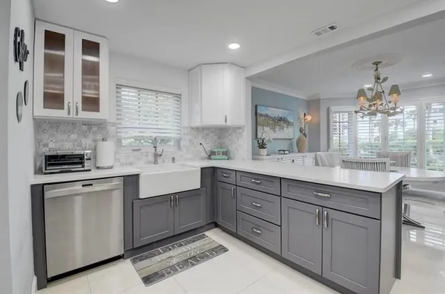 a kitchen with cabinets and window