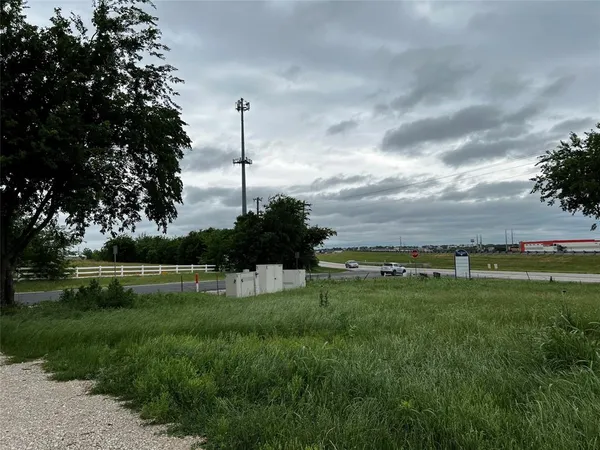a view of a golf course with a lake