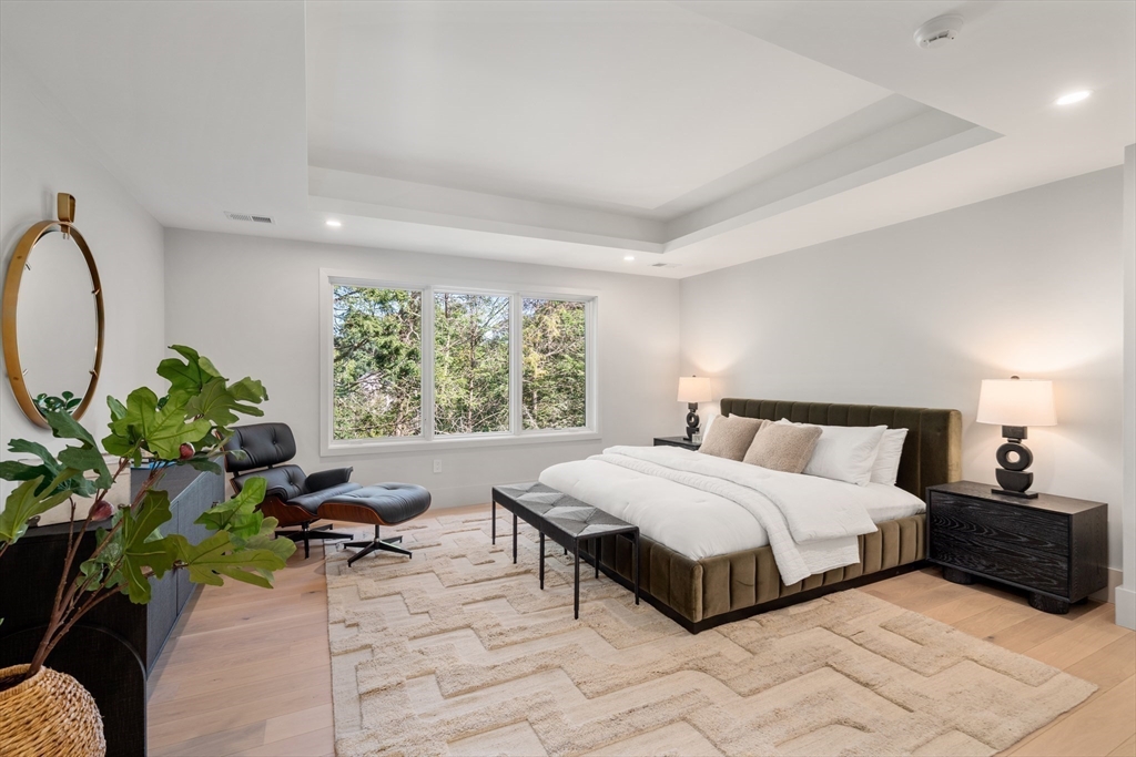20 Old Farm Road Newton, MA 02459 - Photo 23 of 39 a bedroom with a bed potted plant on the dresser and a large window
