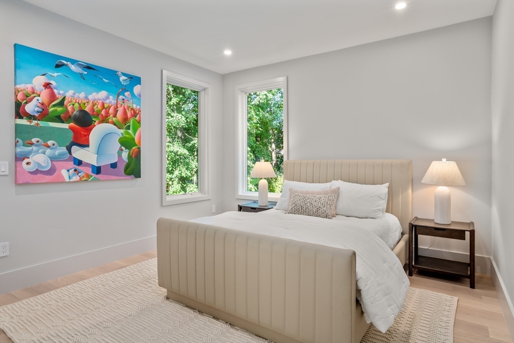 20 Old Farm Road Newton, MA 02459 - Photo 27 of 39 a bedroom with a bed and a painting on the wall