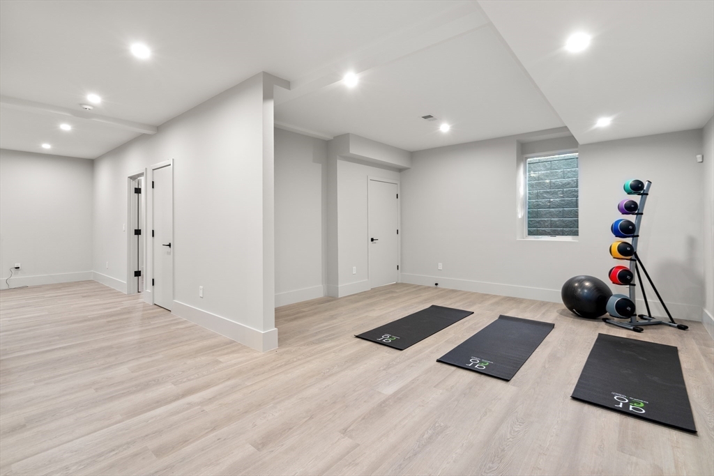 20 Old Farm Road Newton, MA 02459 - Photo 30 of 39 a room with a bed and a wooden floor