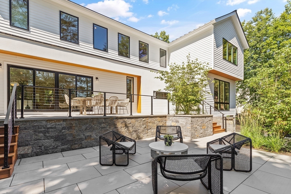 20 Old Farm Road Newton, MA 02459 - Photo 34 of 39 a view of a patio with table and chairs and potted plants