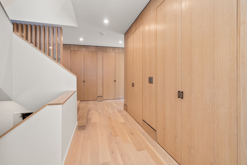 20 Old Farm Road Newton, MA 02459 - Photo 7 of 39 a view of a hallway with wooden floor and staircase