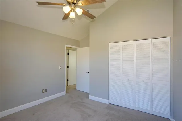 a view of a room with an empty space and a window