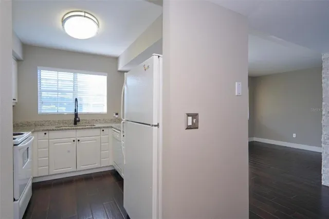 a view of hallway with washer and dryer