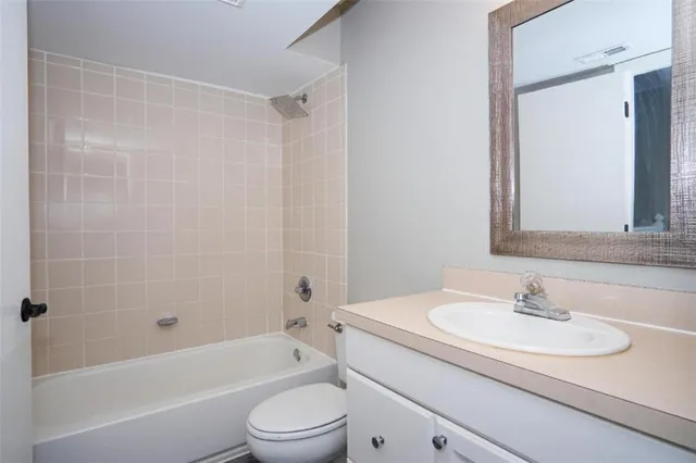 a bathroom with a sink double vanity and a mirror