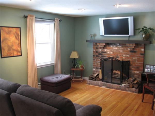 1244 Burts Pit Road Northampton, MA 01062 - Photo 11 of 30 a living room with furniture a flat screen tv and a fireplace