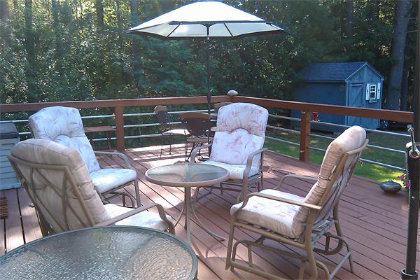 1244 Burts Pit Road Northampton, MA 01062 - Photo 19 of 30 a view of an outdoor sitting area with furniture and wooden deck