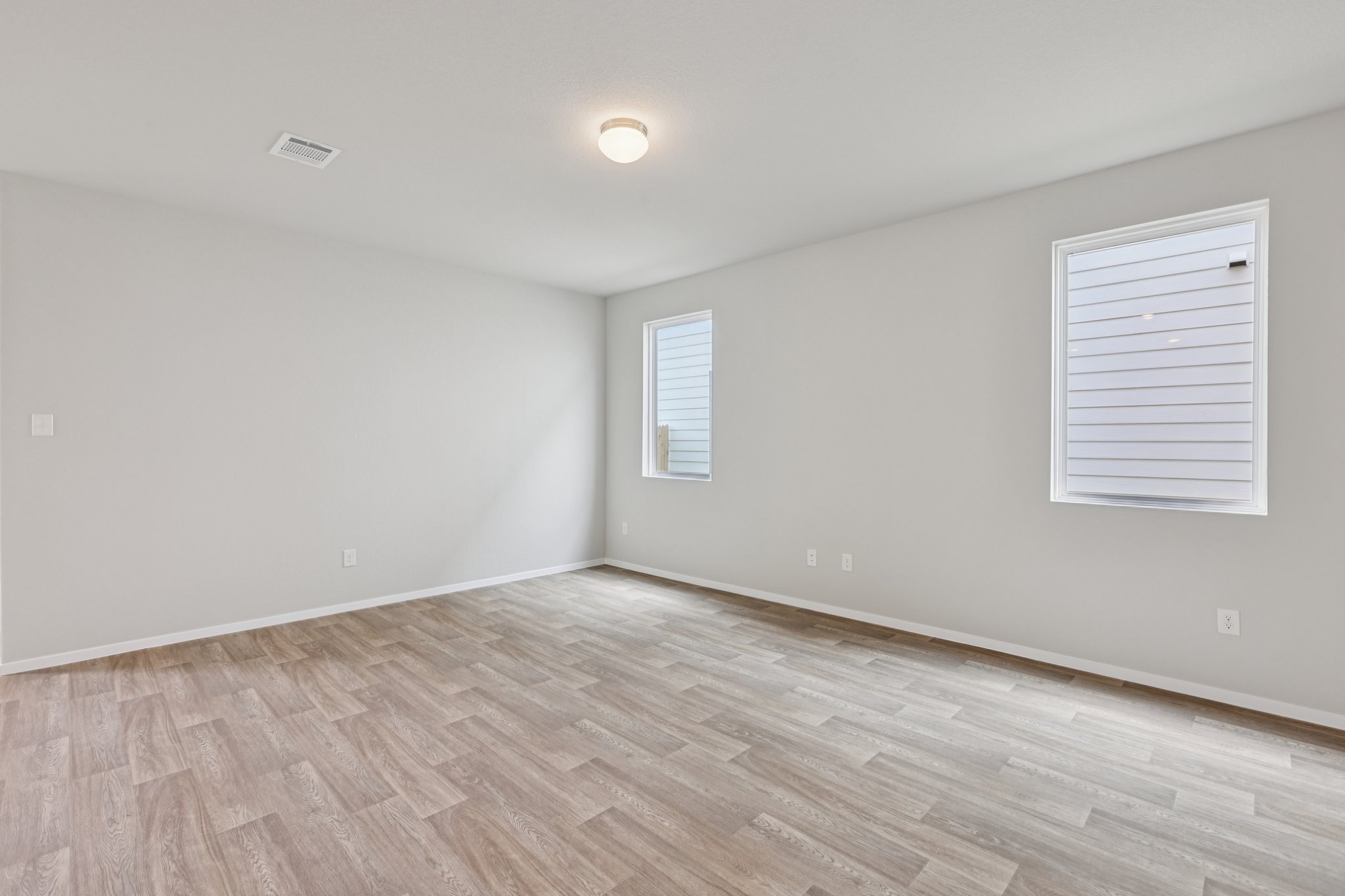 297 Jade Street Maxwell, TX 78656 - Photo 12 of 40 a view of an empty room with wooden floor and a window