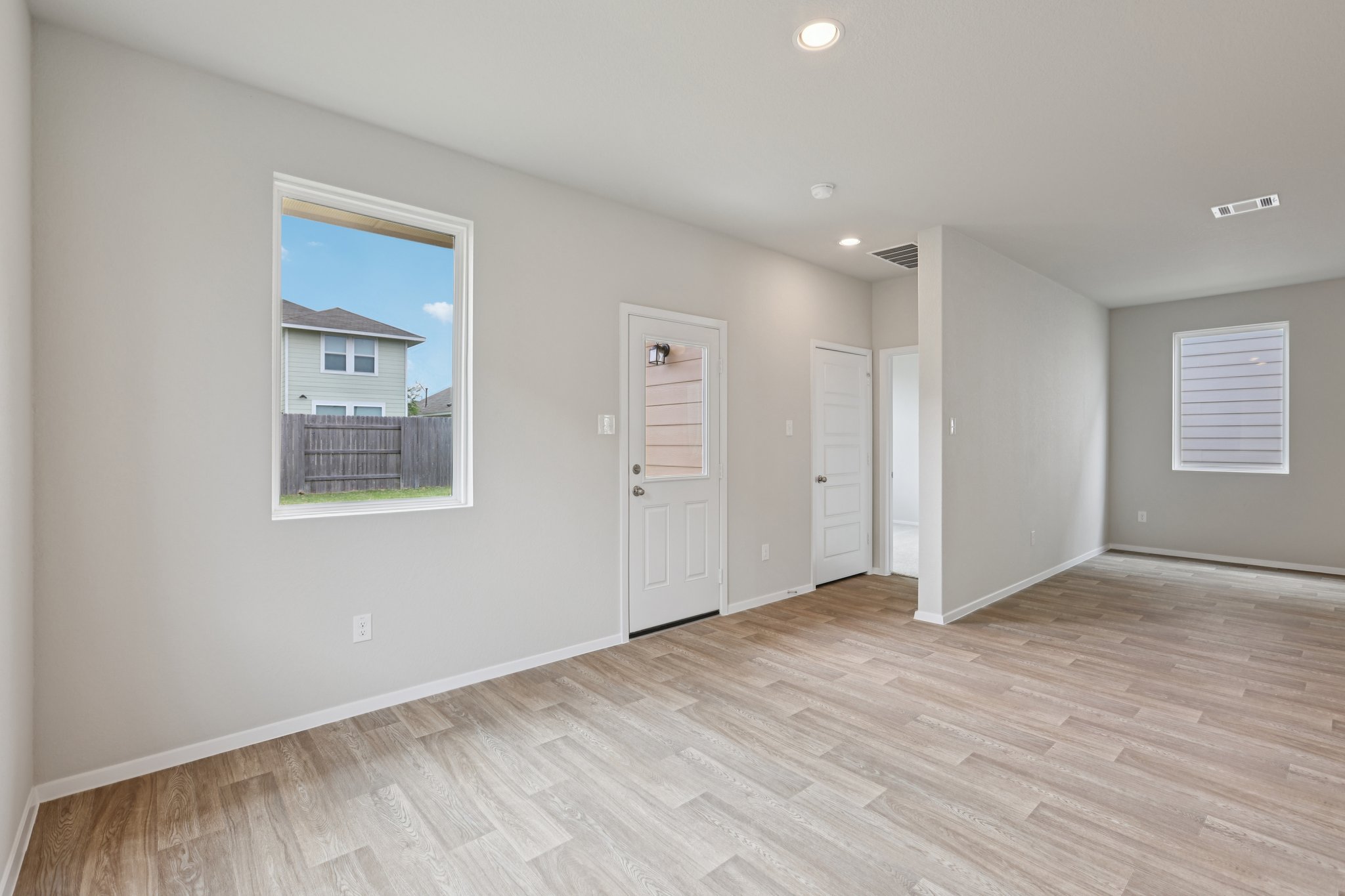 297 Jade Street Maxwell, TX 78656 - Photo 13 of 40 a view of an empty room with wooden floor and a window