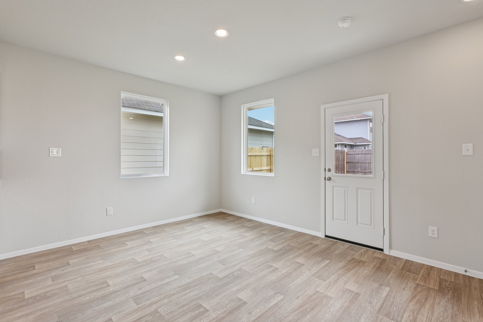297 Jade Street Maxwell, TX 78656 - Photo 14 of 40 a view of an empty room with a window and wooden floor